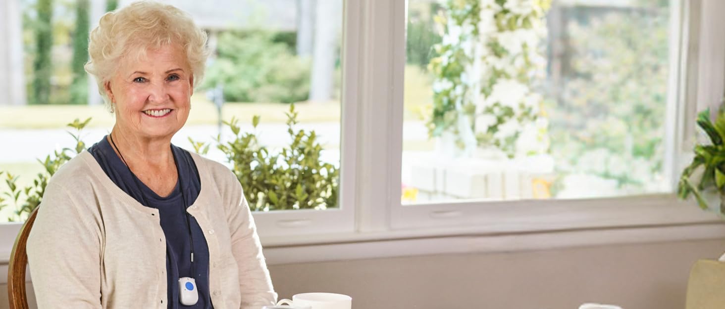 Senior wearing fall detection pendant