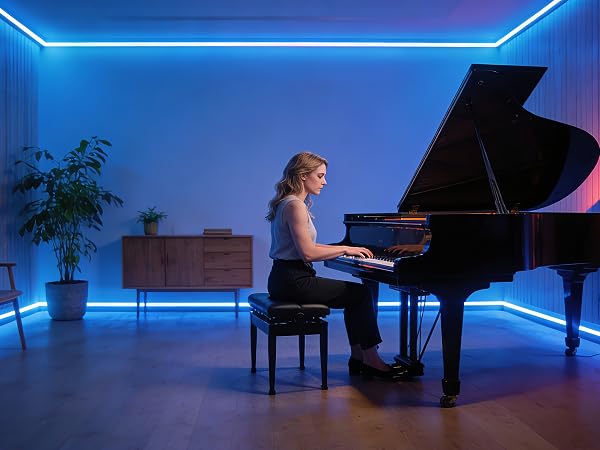 Grand piano performance scene in modern space with dramatic blue LED lighting strips along walls. Interior features potted plant and minimalist design.