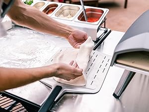a man making a pizza dough
