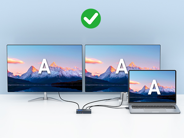 Multiple computer monitor displays showing mountain landscape scenes against pink-orange sunset skies. Green checkmark icon visible in one panel.
