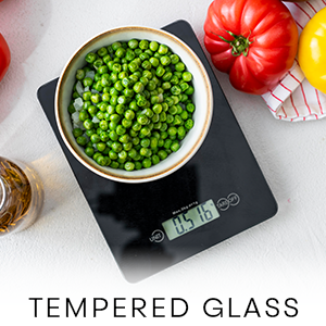 Scale weighing out a bowl of garden peas
