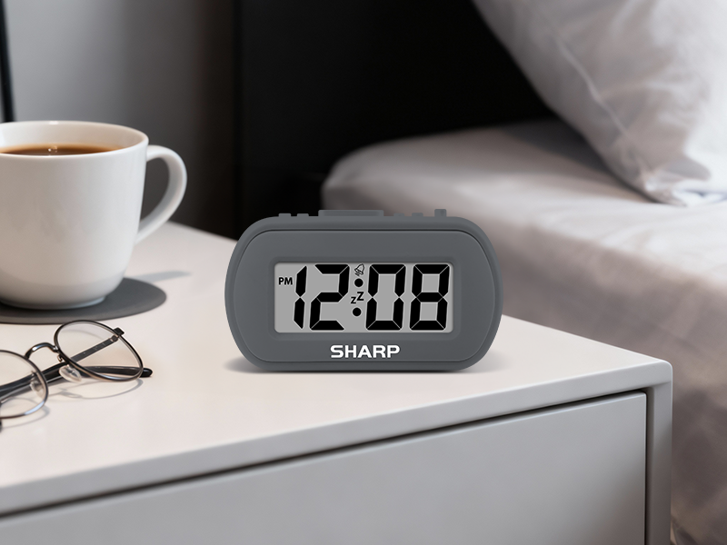 Sharp SPC483 battery powered alarm clock rubberized rubber small compact