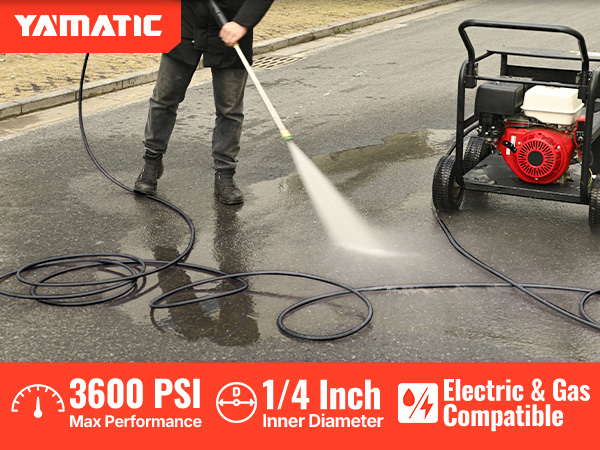 washing the drive way with the pressure washer hose