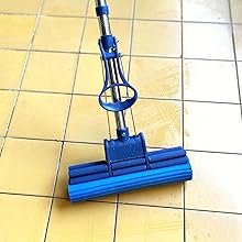 a blue vacuum cleaner on a tile floor.