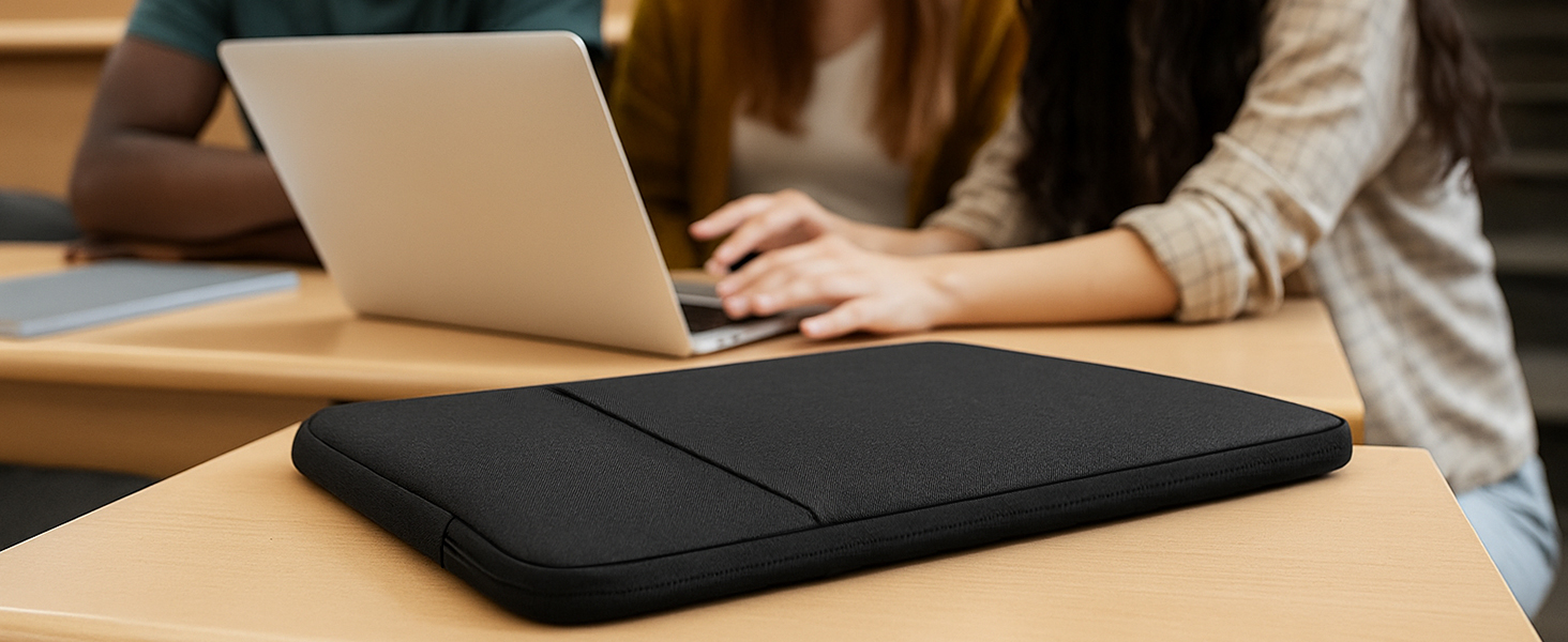 Close-up of laptop on dark cushioned lap desk or laptop pad, showing workspace setup on wooden surface.
