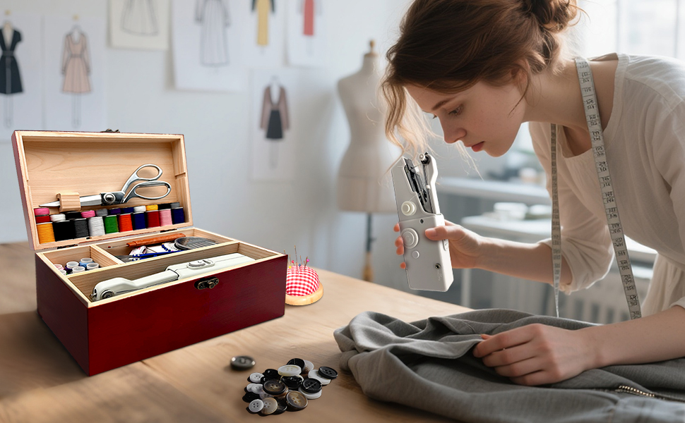 The sewing mannequin is holding a sewing machine and sewing.