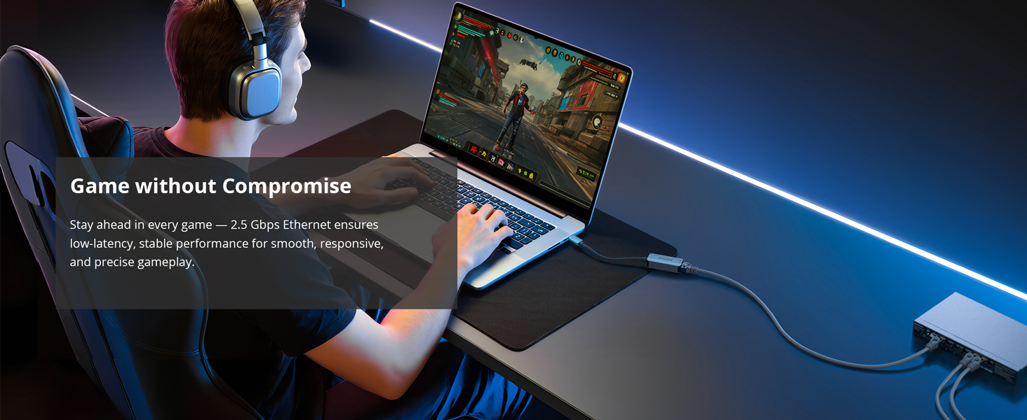 A Man Is Playing Online Game on a Laptop via USB-C to Ethernet Adapter