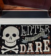 Coir doormat placed in front of a front door with the text Boo! in gothic font