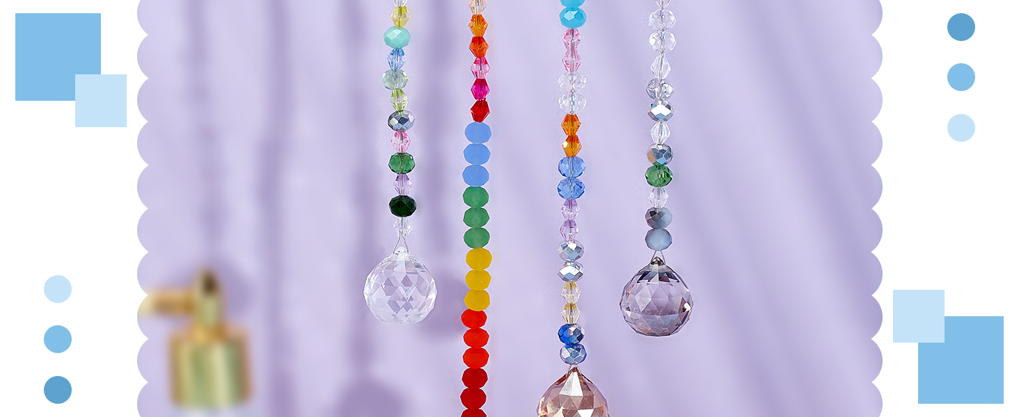 Decorative crystal suncatchers with colorful beads and clear prisms hanging against a light purple background.