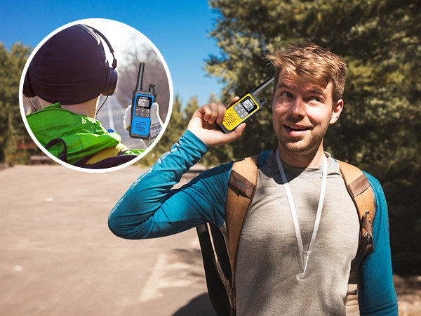 Hiker using walkie talkies long range in forest talking to long distant friend