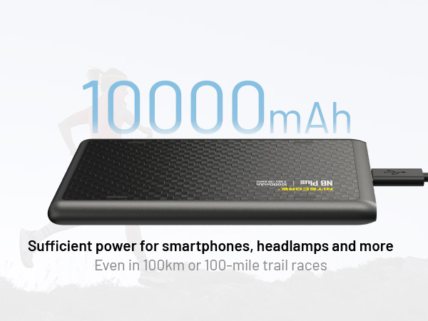 The NB PLus with a cord connected to it and a runner in the background.