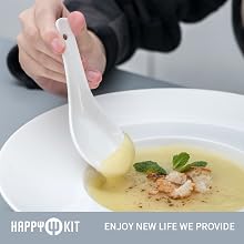 having soup with a ceramic spoon