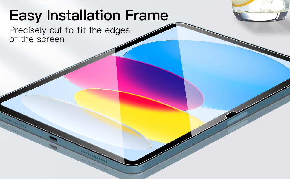 Tablet screen protector installation frame showing precise edge fitting. Displays colorful geometric gradient pattern on screen.