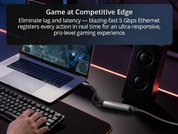 A Man Is Playing Online Game on a Laptop via USB-C to Ethernet Adapter