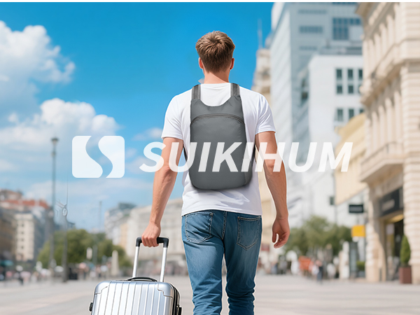 Man with SUIKIHUM backpack traveling in city.