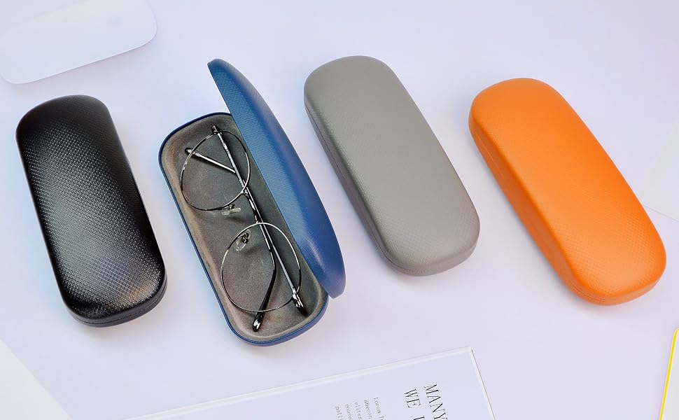 Four eyeglass cases in different colors: black, blue, gray, and orange. One case is open, displaying a pair of glasses with thin metal frames.