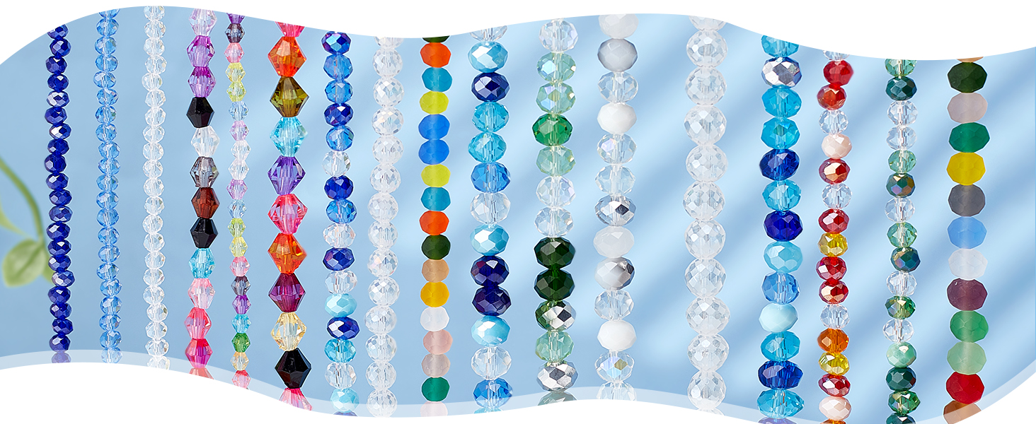 Wavy display of colorful crystal beads arranged in vertical strands, featuring various sizes and shades of blue, pink, clear, and multicolored crystals.