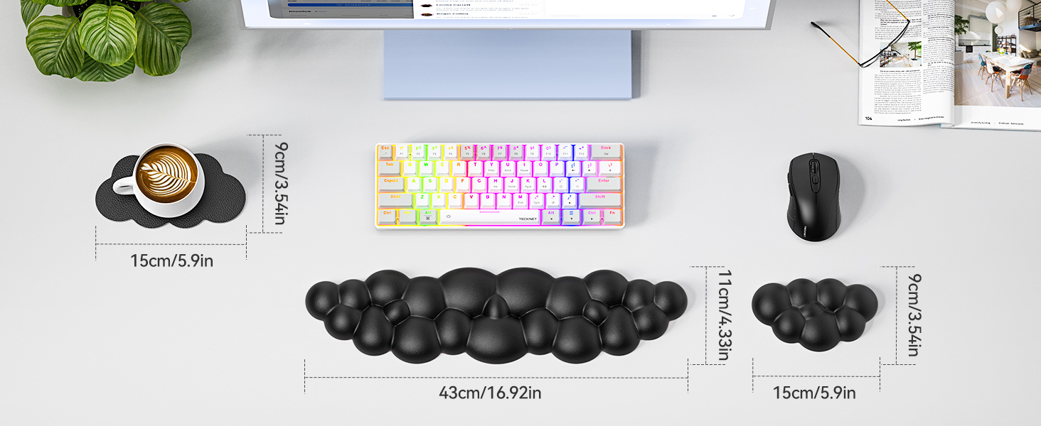 Desk setup with colorful keyboard, black mouse, and elongated black cushion. Includes plant, coffee cup, and dimensions for cushion sections.