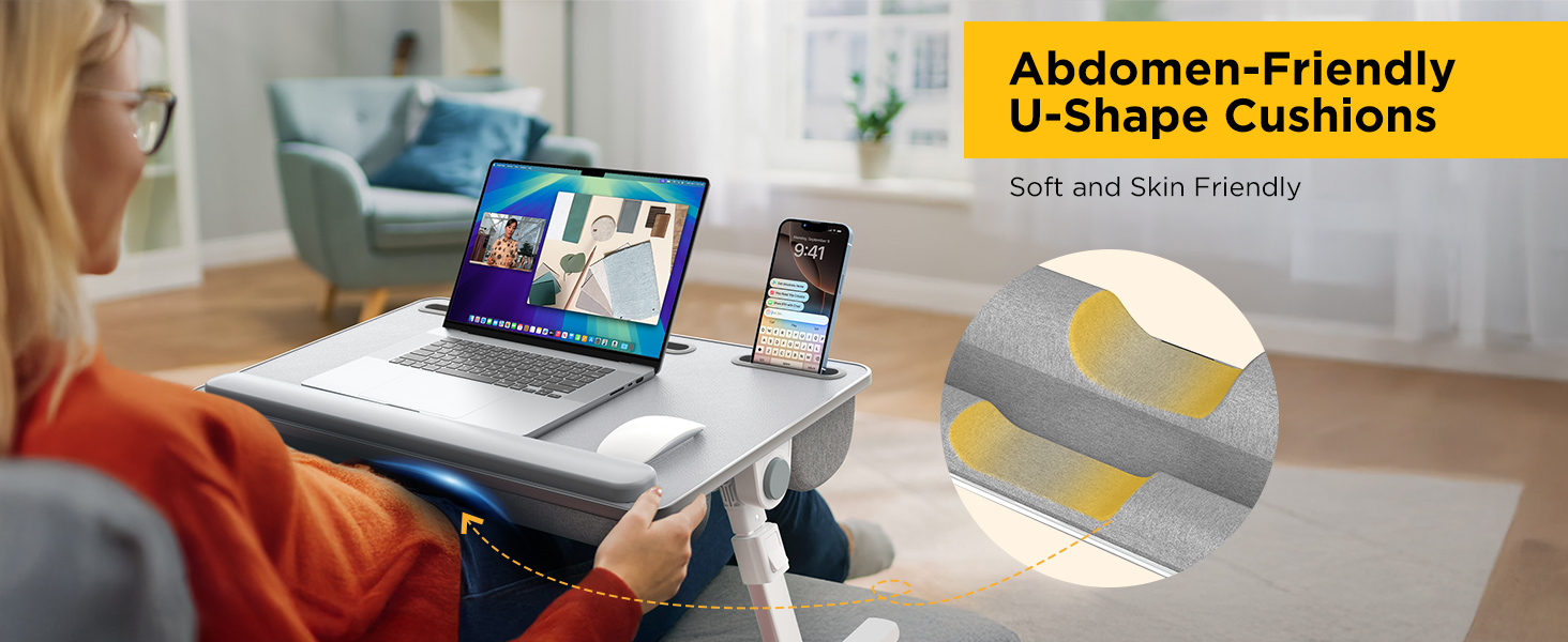 Woman relaxing with an ergonomic lap desk for laptop featuring abdominal support curve.