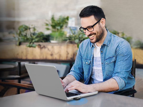 A Man Enjoys Fast WiFi on His Laptop PC with This AX900 Dual Band USB WiFi 6 Adapter