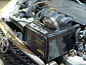 Car battery charger with a durable metal case and heavy-duty construction for reliable use.