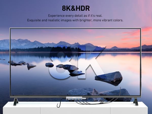 Large flat-screen TV displaying a serene lakeside sunset scene with mountains. Text overlay reads '8K&amp;HDR' and describes image quality.