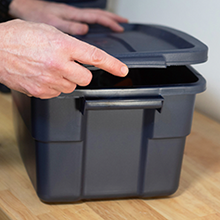 person snapping lid onto container