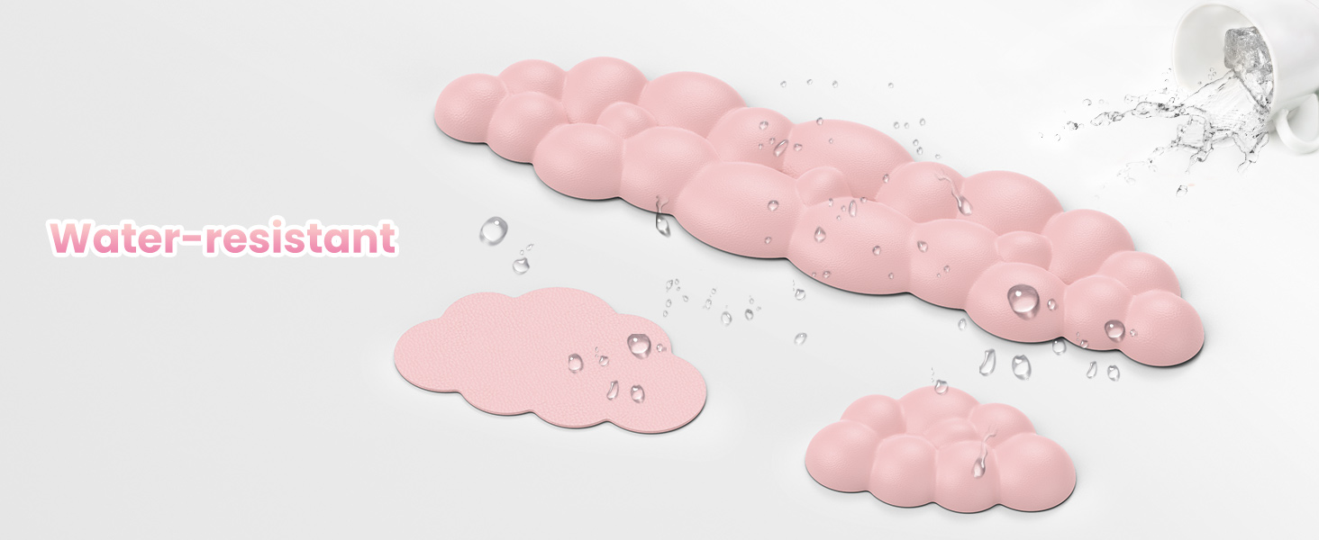 Pink cloud-shaped bath mats with textured surfaces. Water droplets visible, demonstrating water-resistant properties. Multiple sizes shown.