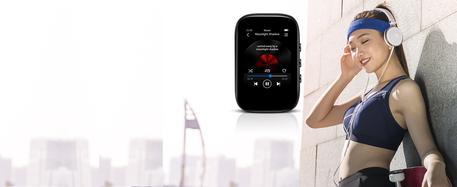 Portable music device with screen displaying song information. Person wearing sports attire and headphones, leaning against wall, suggesting use during exercise.