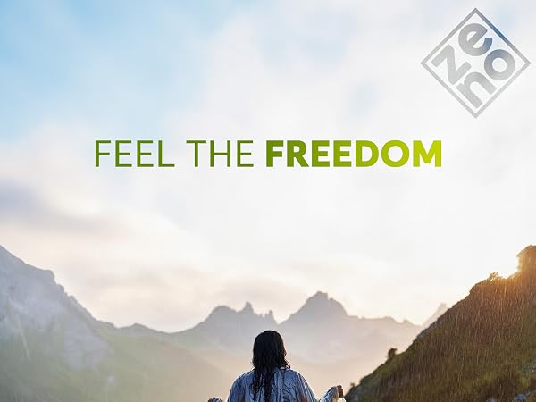 Person facing mountain landscape at sunset. Text overlay reads 'FEEL THE FREEDOM' in green. Gray logo in top right corner.