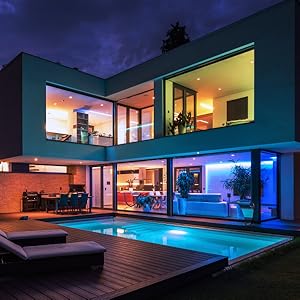 6-inch recessed LED smart downlights turned on at night for added home security.