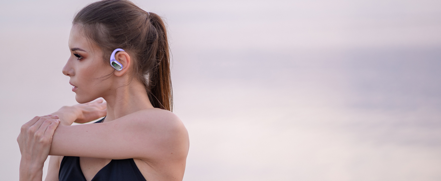Wireless blue earpiece device shown in profile view, worn on the ear.