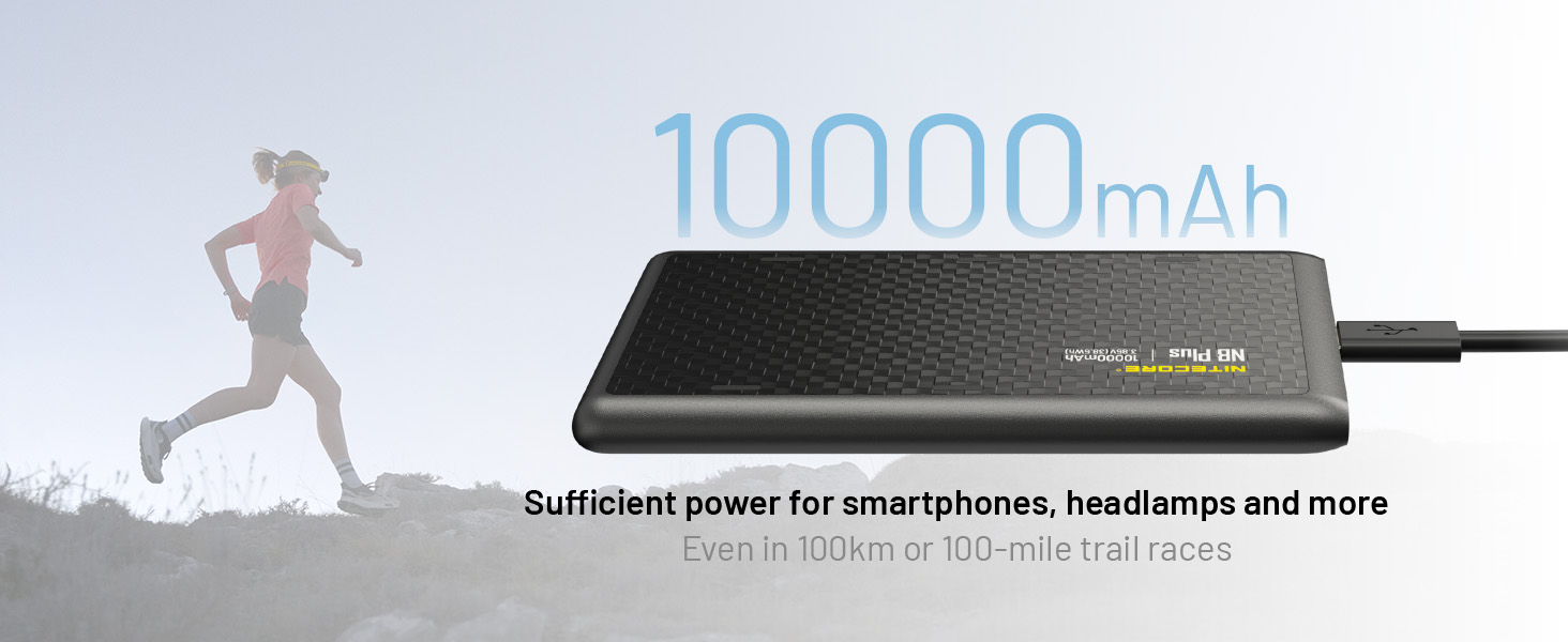 The NB PLus with a cord connected to it and a runner in the background.