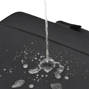 Water stream falling onto dark surface, creating splash and droplets. Demonstrates water-resistant or waterproof properties.