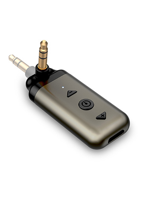 Small metallic device with audio jack, buttons, and compact design, likely for audio control or connectivity.