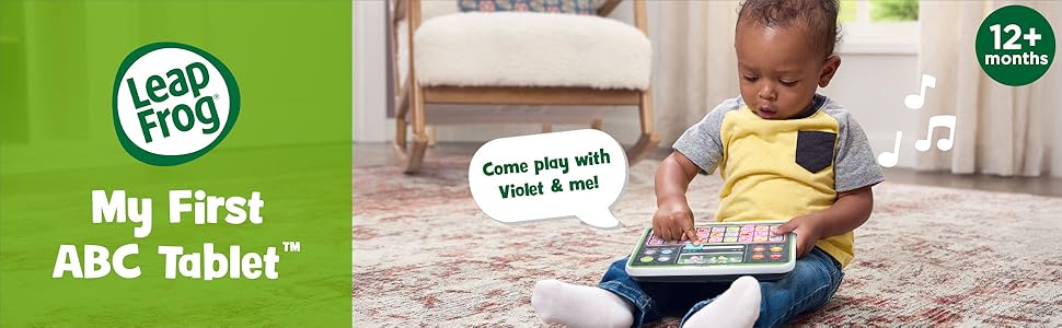 Kid slides LeapFrog My First ABC Tablet slider. Tablet says: Come play with Violet &amp; me! 12+ months.