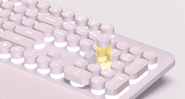 backlit keyboard showing illuminated round keys, number pad, and foldable tilt legs