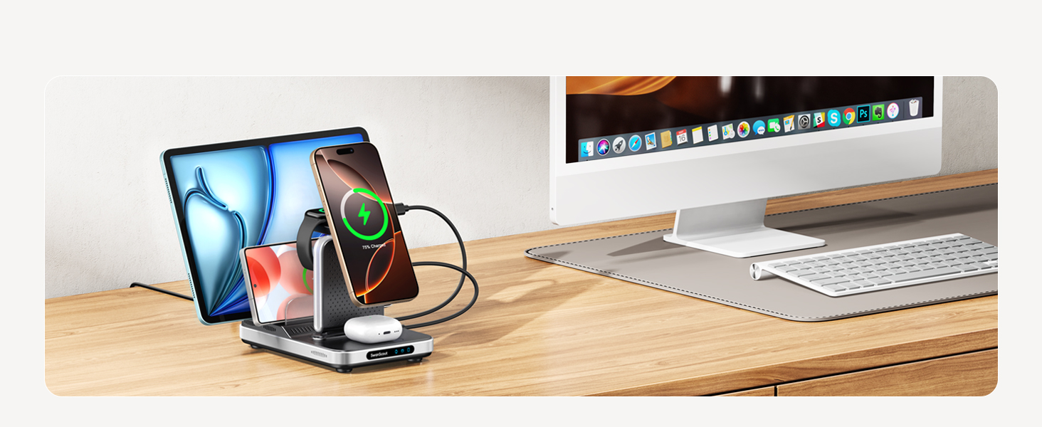 Wireless charging station on wooden desk, powering multiple devices including smartphones and tablet. Desktop computer setup visible in background.