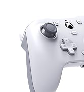 Close-up of a white video game controller with analog stick, D-pad, and buttons visible.