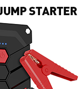 Partial view of a black and red jump starter device, showing connection clamps.