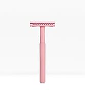 a pink razor with a white background.