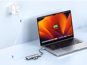 a laptop with a charging port plugged into the wall