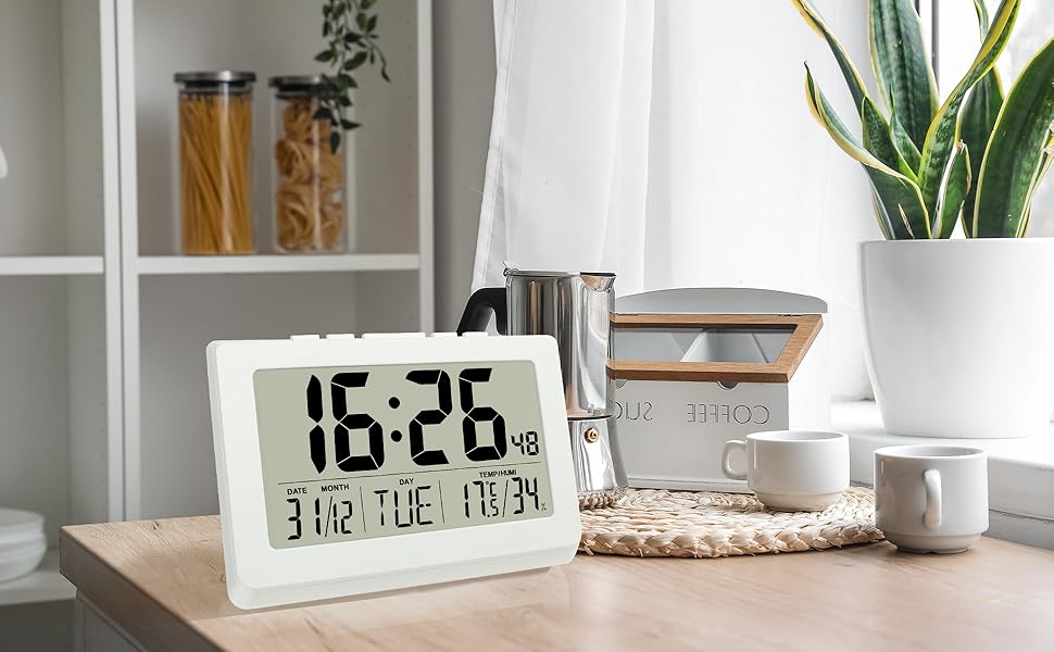 white digital alarm clock desk