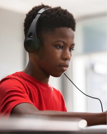 Student using TWT Audio ERGO headphones to study while using a tablet
