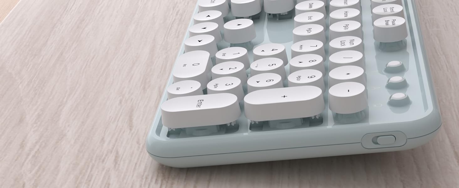 green white wireless keyboard and mouse