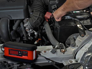 Car battery charger and maintainer has quick-connect harness for fast hook up of two connectors.