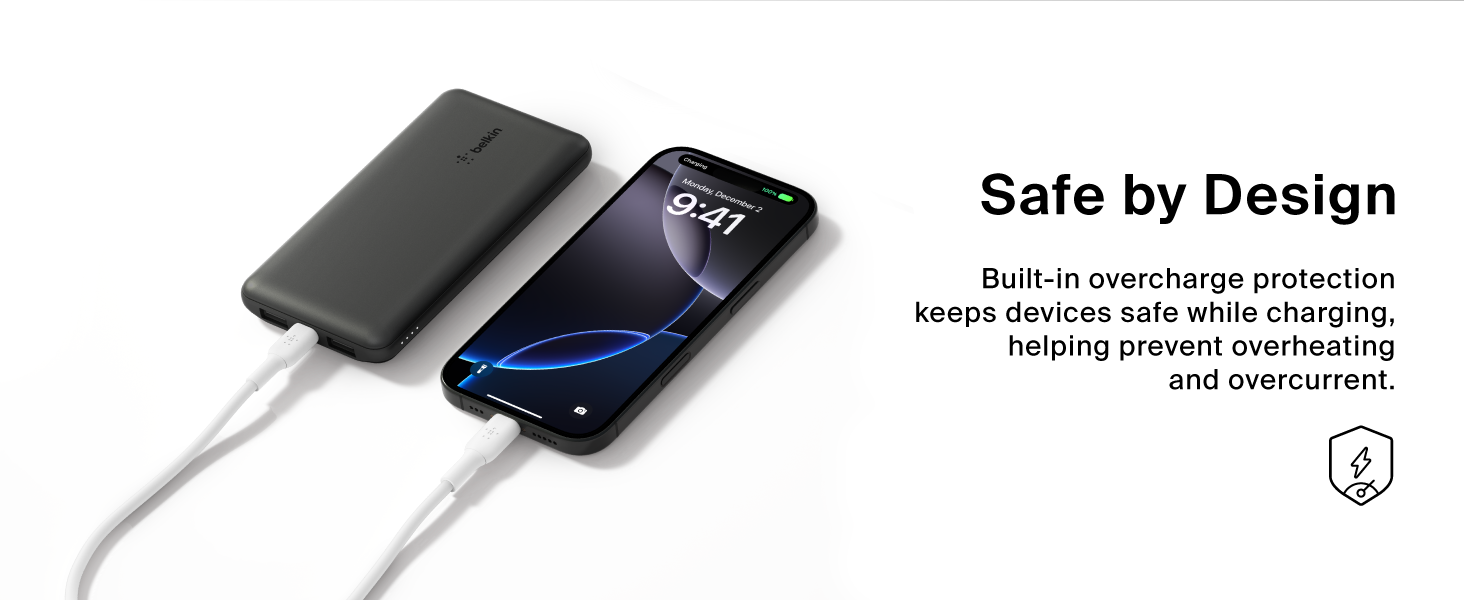 Image of power block charging phone with text reading safe by design.