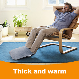 a man is sitting in a chair with a foot brace on his foot.