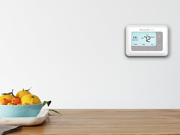 RTH7560E on wall on wall above kitchen table