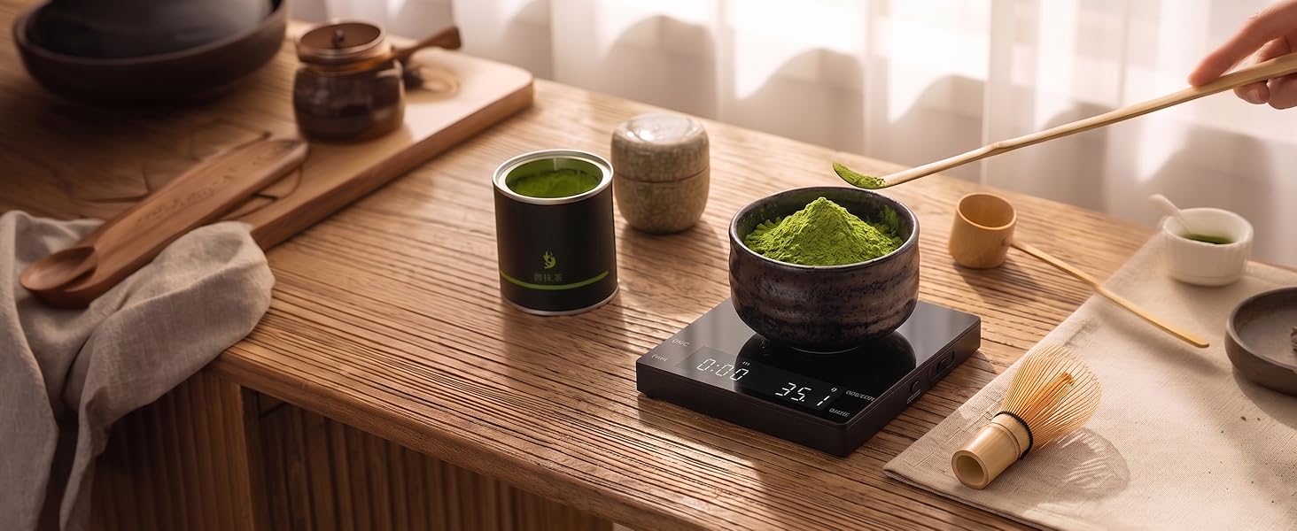 A small scale is weighing matcha.